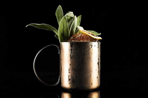 Highend craft cocktail isolated on a black background