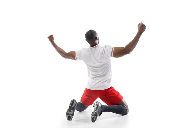 Highly upset, nervous. professional football, soccer player isolated on white studio wall.