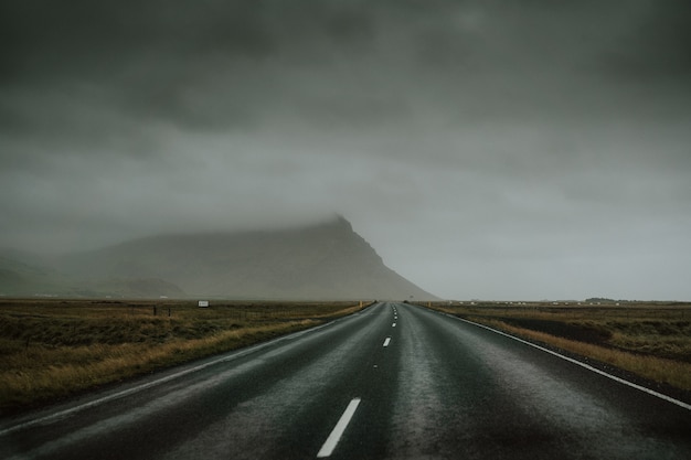 Free Photo highway on mountain road in a cloudy day