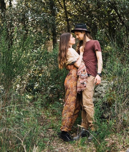 Hiker couple in love kissing in nature