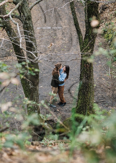 Hiker couple in love kissing in nature