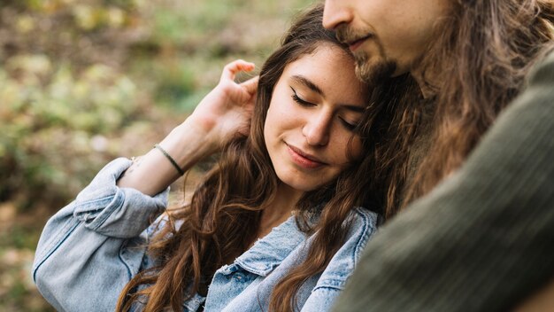 Hiker couple in love sitting in nature