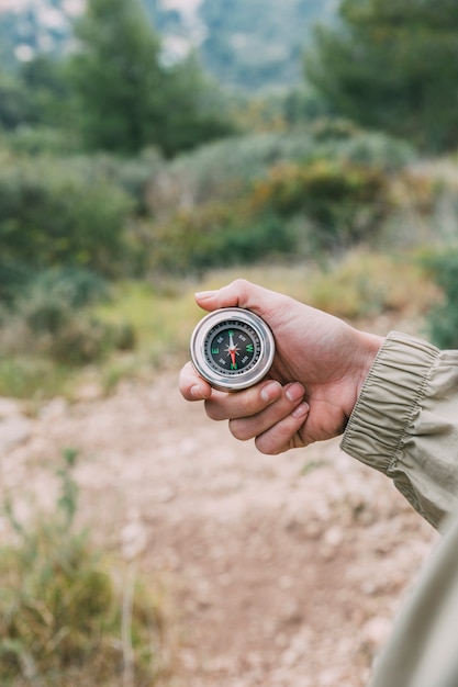 Hiker holding compass