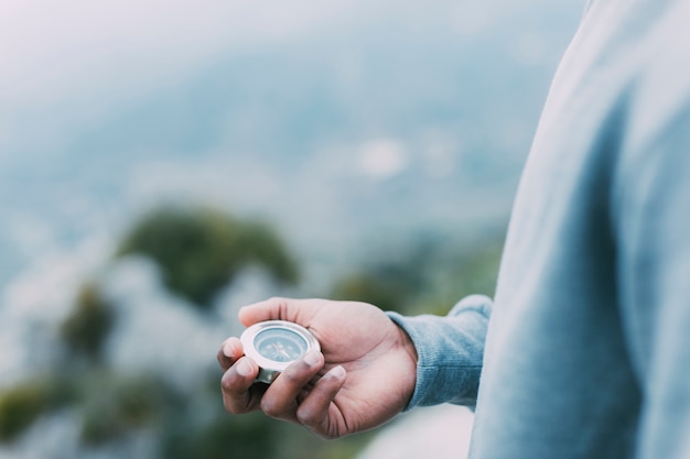 Hiker looking at compass