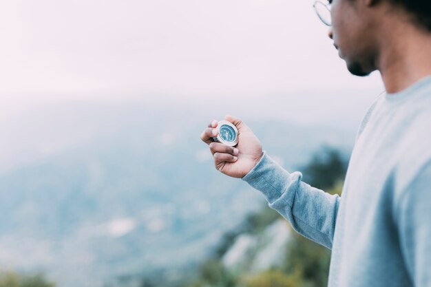 Hiker looking at compass