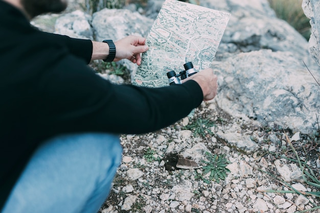 Free photo hiker looking at map