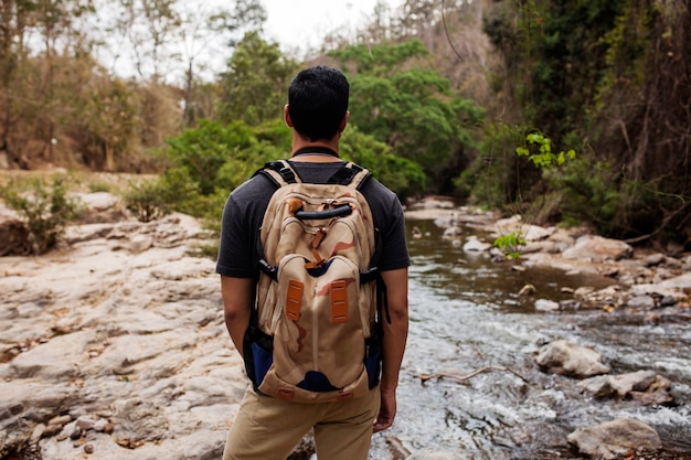 Free photo hiker looking at river