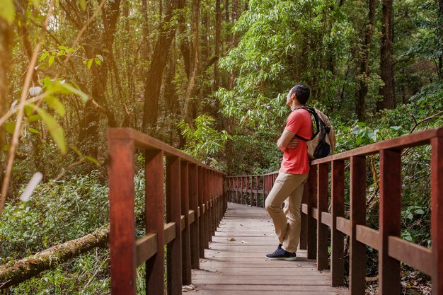 Hiker taking a rest on a bridge