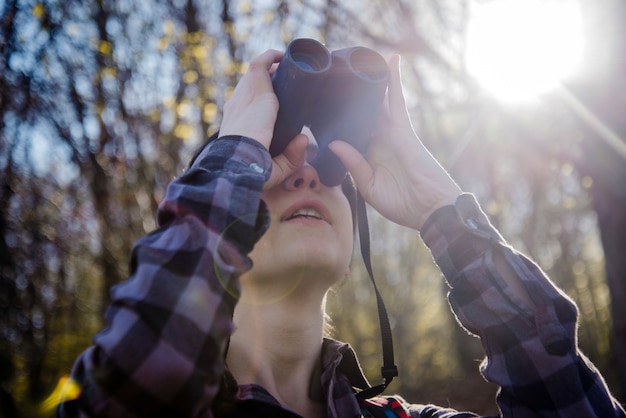 Free Photo hiker with binoculars on a sunny day