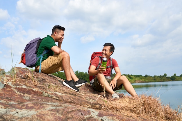 Hikers resting on mountain top