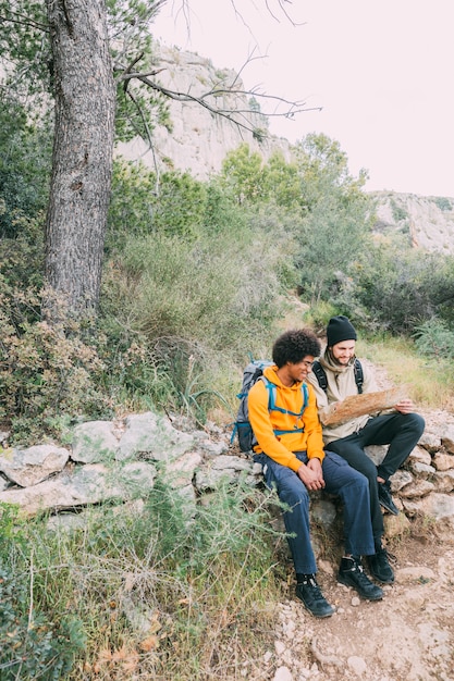 Hikers sitting on rock