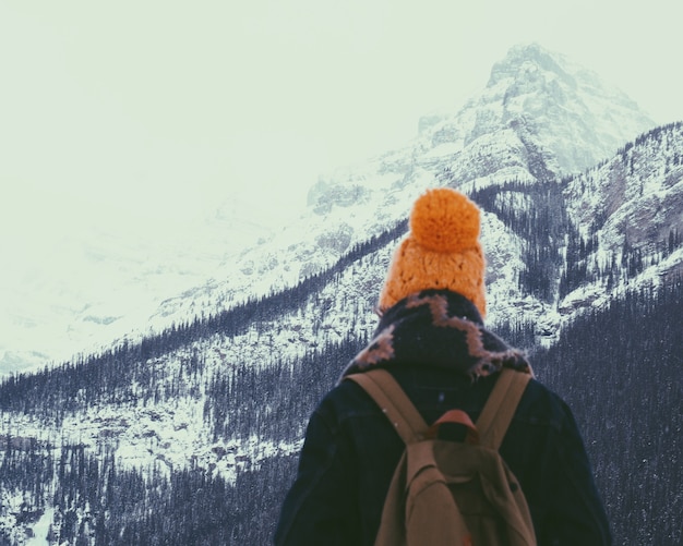 Free photo hiking on a snowy mountain