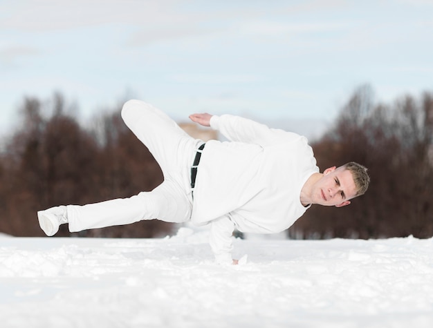 Hip hop dancer balancing body on one hand