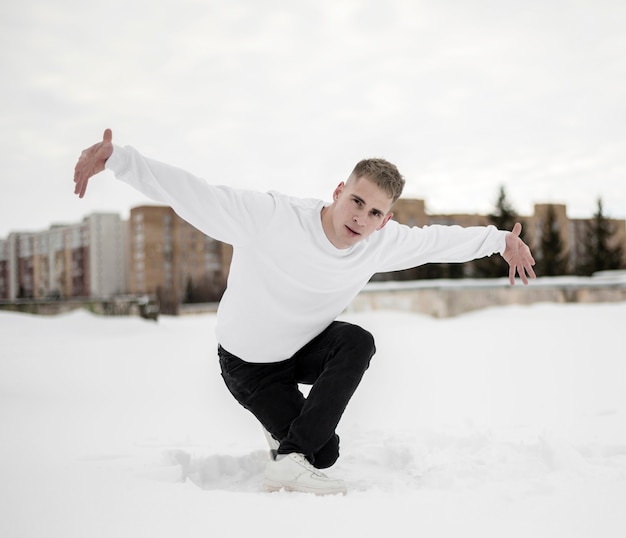 Hip hop performer in the snow outside