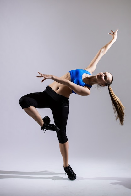 Hip hop woman dancer performing isolated on a white background