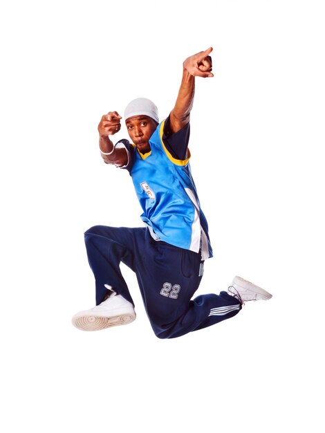 Hip-hop young man making cool move on white background