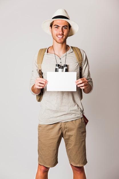 Free photo hipster man showing paper