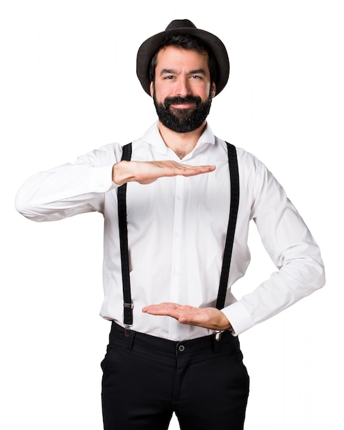 Free photo hipster man with beard holding something