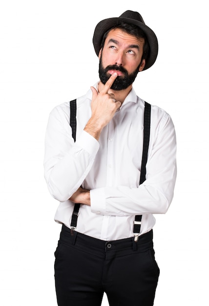 Hipster man with beard thinking