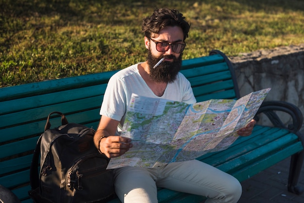 Free photo hipster on vacation on bench