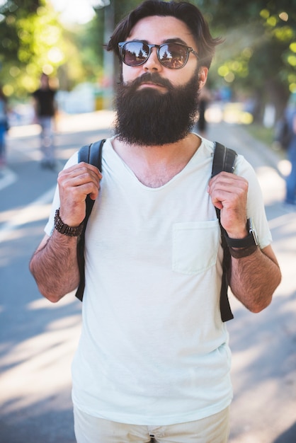 Hipster on vacation next to lake