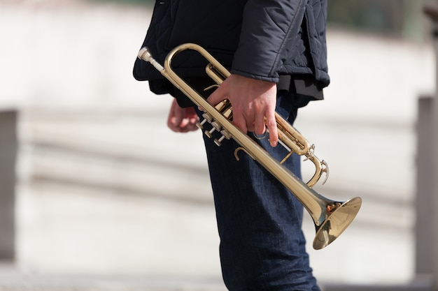 Free Photo holding trumpet side view