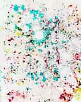 Free photo holi color powder splatter on white backdrop