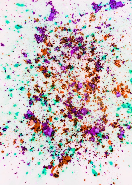 Free photo holi color powder on white backdrop