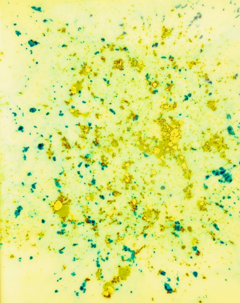 Holi color powder on yellow surface background