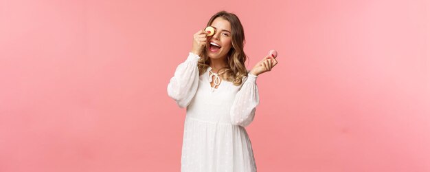 Holidays spring and party concept portrait of carefree tender and feminine girl in white dress holdi