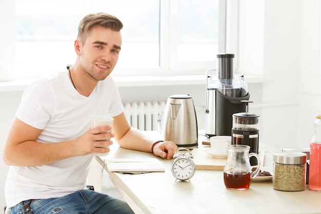 Home, morning. Man by the table