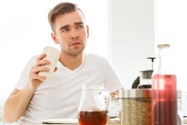 Home, morning. Man by the table