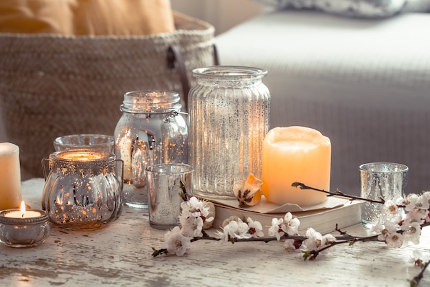 Free photo home still life with candles and vase in the living room