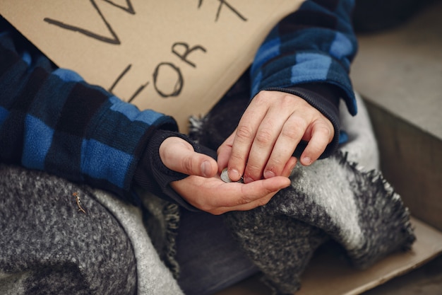 Free photo homeless man in a durty clothes autumn city