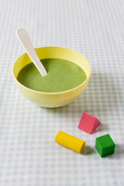 Homemade baby food with toys