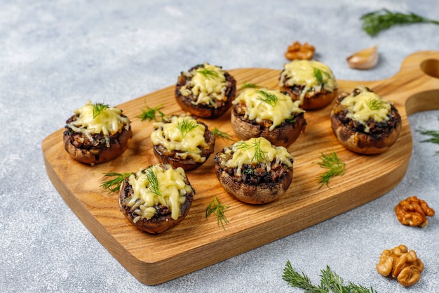 Free photo homemade baked stuffed champignon mushrooms with fresh dill and cheese