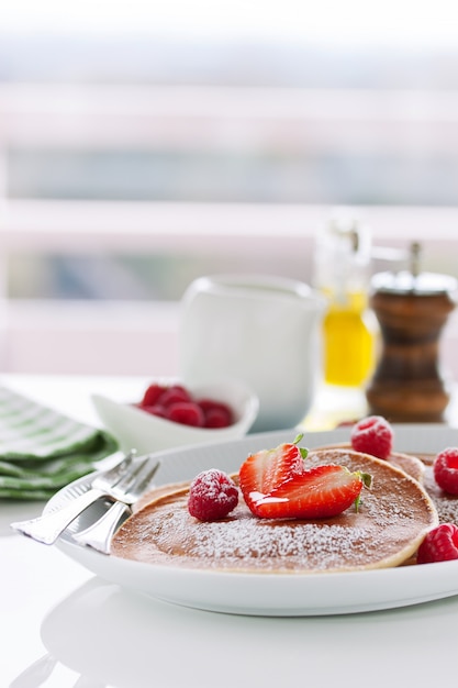 Homemade buttermilk pancakes with fresh strawberry