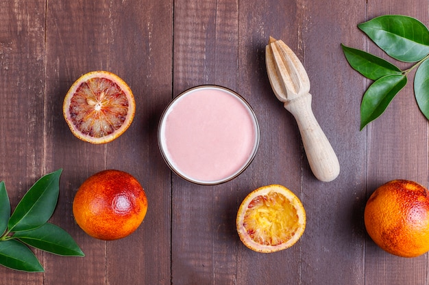 Free photo homemade delicious blood orange glaze with fresh blood orange fruits.