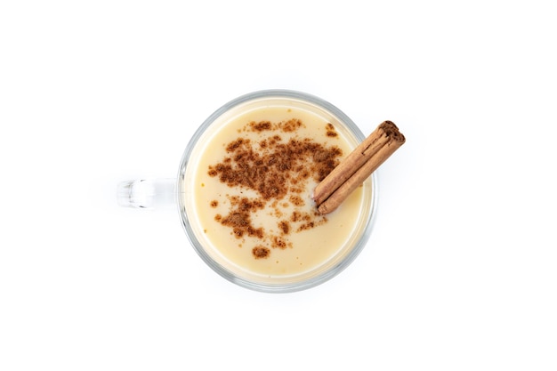 Free photo homemade eggnog with cinnamon on wooden table typical christmas dessert