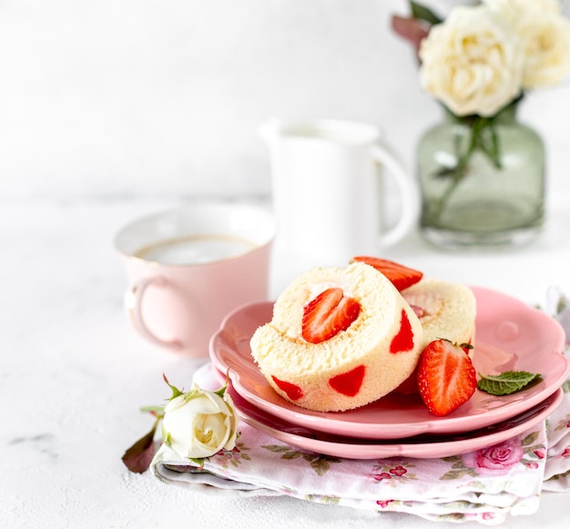 Homemade festive Swiss roll with strawberries and cream Selective focus