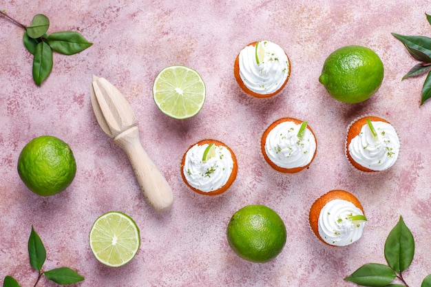 Free photo homemade key lime cupcakes with whipped cream and lime zest