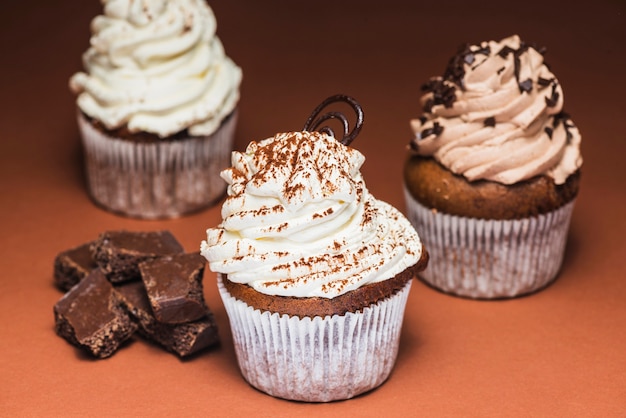 Homemade muffins with swirled cream topping