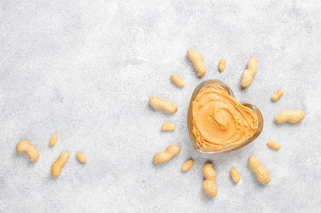 Homemade organic peanut butter with peanuts.