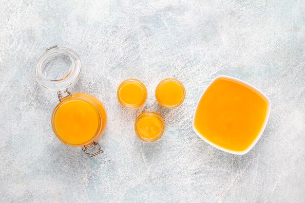 Homemade pumpkin puree with fresh pumpkin slices.