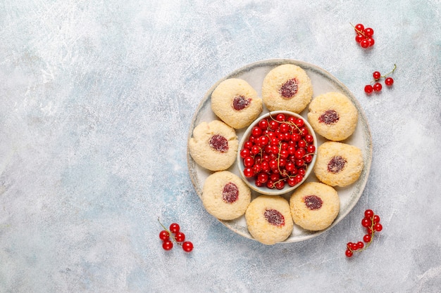 Homemade rustic red currant jam filling cookies with coconut