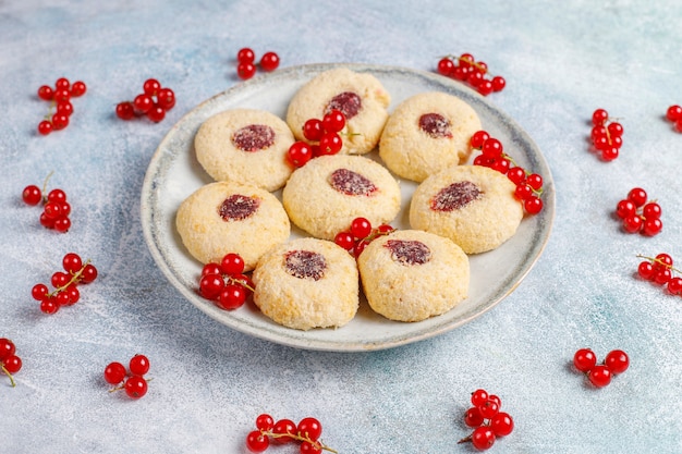 Homemade rustic red currant jam filling cookies with coconut