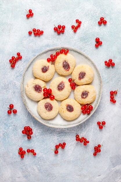 Homemade rustic red currant jam filling cookies with coconut