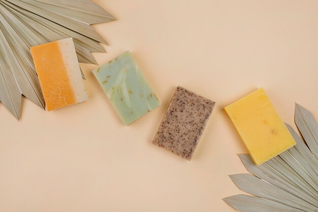 Homemade soap blocks and abstract leaves