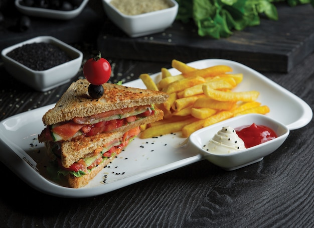 Homemade toast sandwiches with potatoes and sauces.