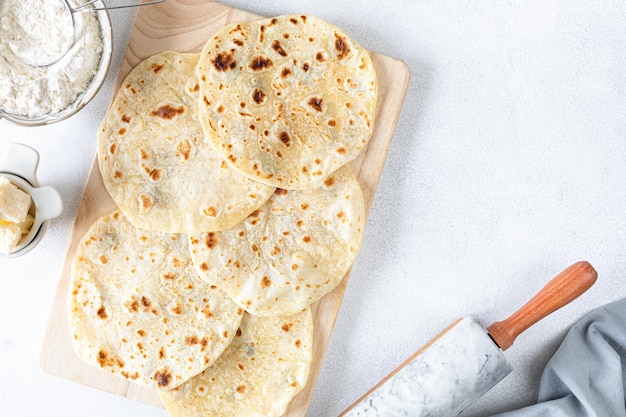 Free Photo homemade wheat tortillas pita bread tortilla pita with ingredients for cooking on a white table top view copy space